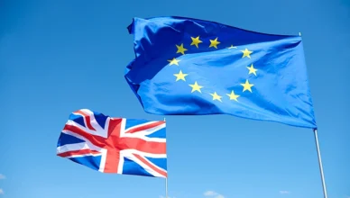 Schengen and UK flags representing visa types side by side.
