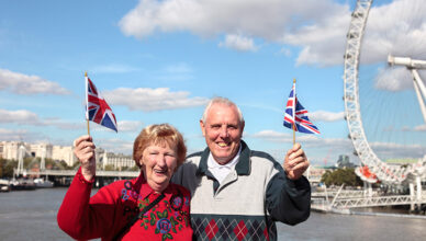 Senior couple holding british flag