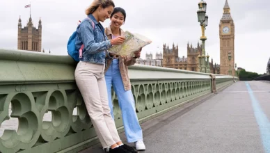 Side view smiley women looking at map