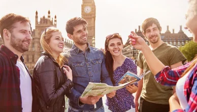 Group of friends walking near Big Ben, UK.