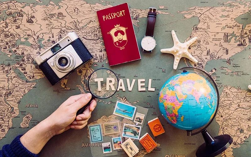 Magnifying glass focusing on travel writing