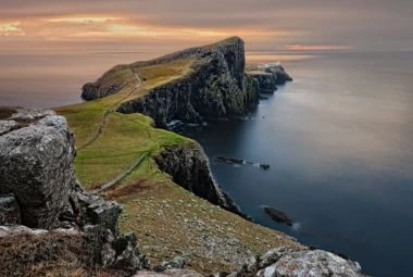 Scenic Landscape with Cliffs and a Lighthouse